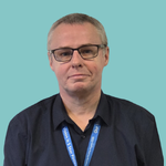 Image of a man with really short greying hair, wearing glasses